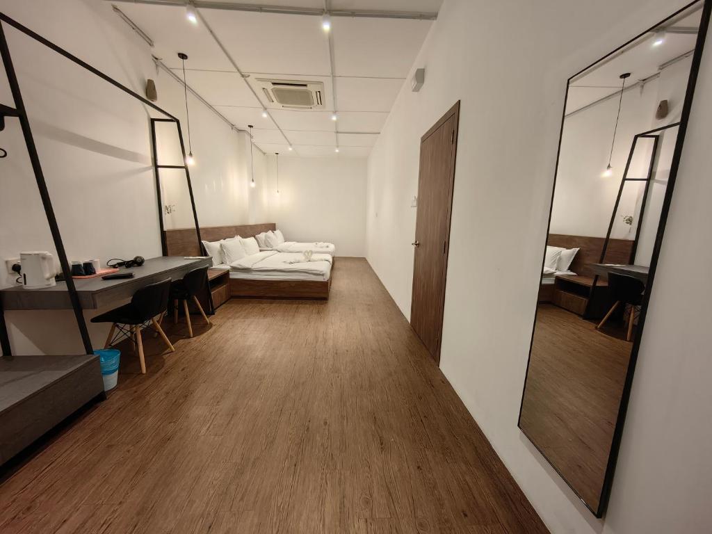 Postel nebo postele na pokoji v ubytování Kangsar Inn 73