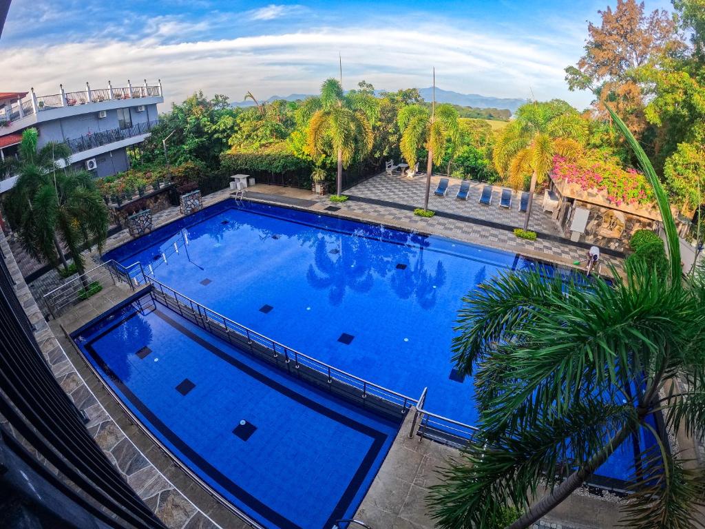 an overhead view of a large blue swimming pool at Centauria Wild in Udawalawe