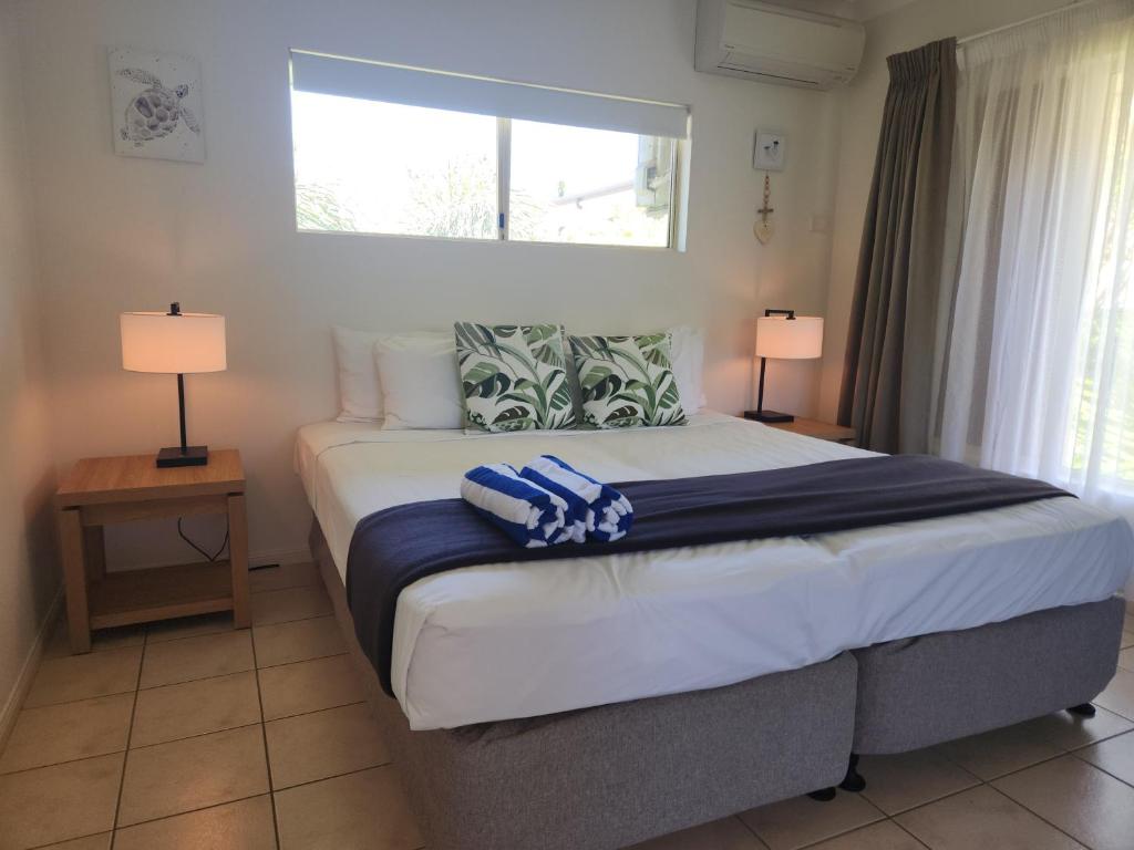 Postel nebo postele na pokoji v ubytování Central Plaza Port Douglas