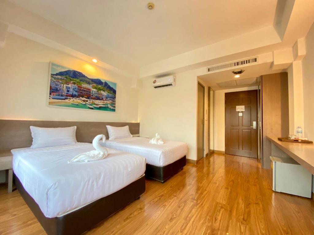 Ένα ή περισσότερα κρεβάτια σε δωμάτιο στο View Dee BKK Airport Residence