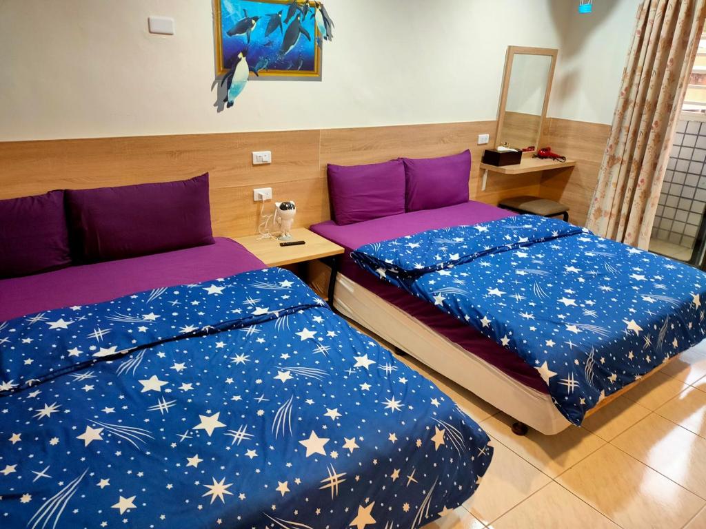 Postel nebo postele na pokoji v ubytování Long Quan Ju