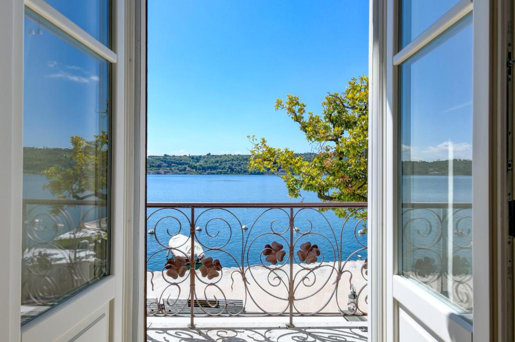 a view from a window of the water at BELVEDERE - Garda Leisure in Salò