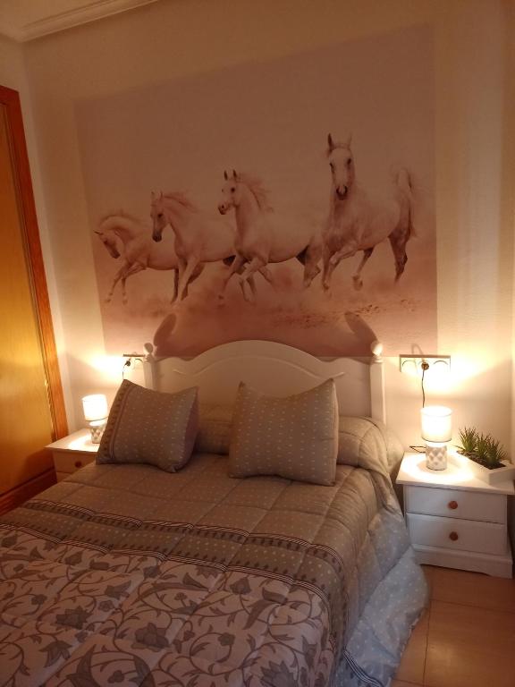 Łóżko lub łóżka w pokoju w obiekcie Alojamiento roquetas de mar