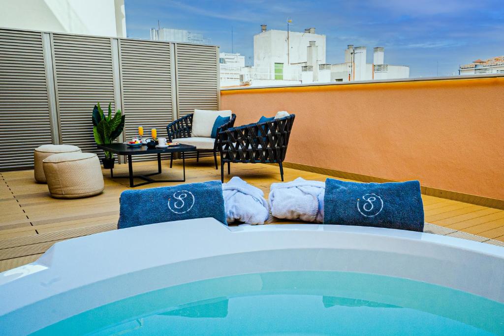 Posezení v ubytování SmartRental Collection Gran Vía Capital