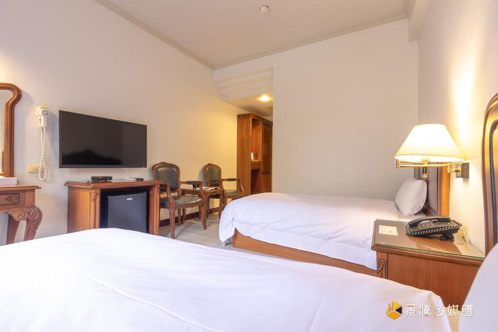 Postel nebo postele na pokoji v ubytování Spring Hotel