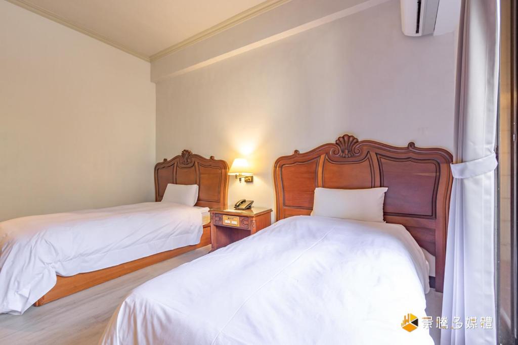 Postel nebo postele na pokoji v ubytování Spring Hotel