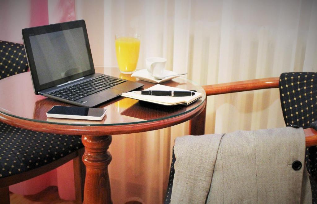 TV a/nebo společenská místnost v ubytování Hotel Rex