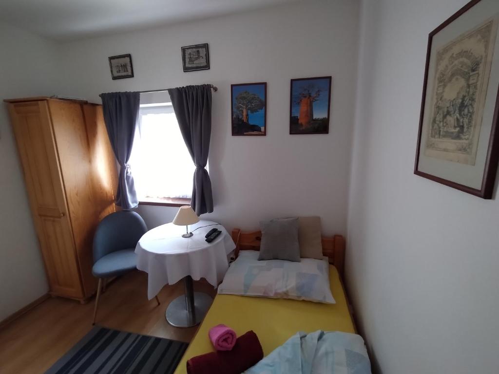 Postel nebo postele na pokoji v ubytování Penzión Evka