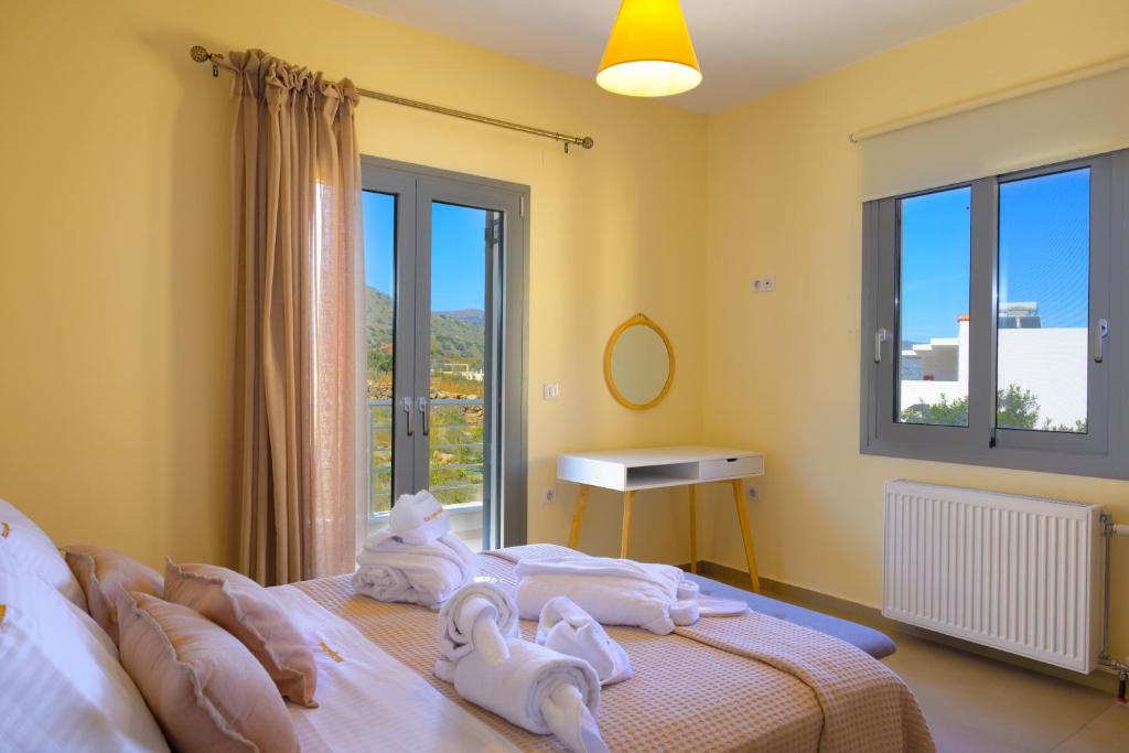 Postel nebo postele na pokoji v ubytování Villa Calypso Elounda
