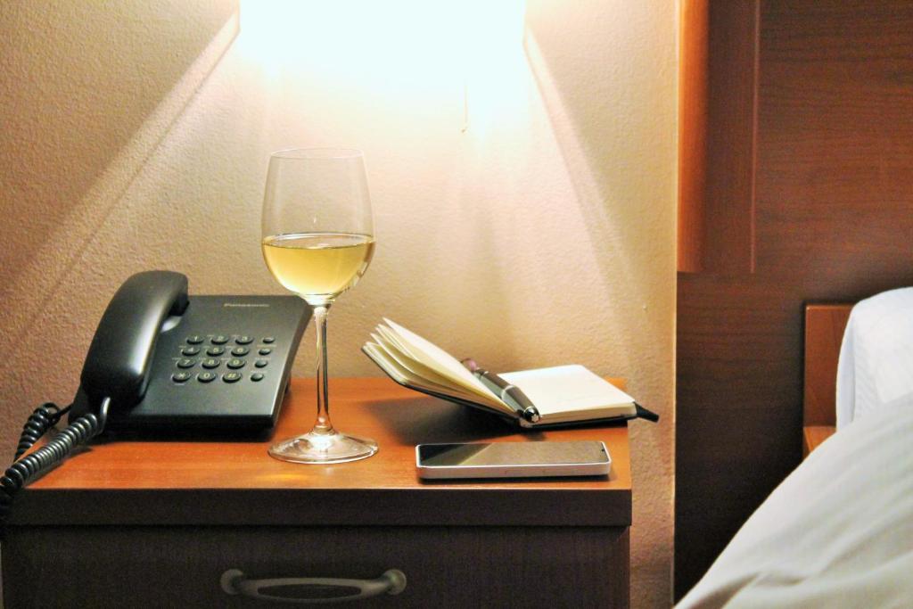 Postel nebo postele na pokoji v ubytování Hotel Rex