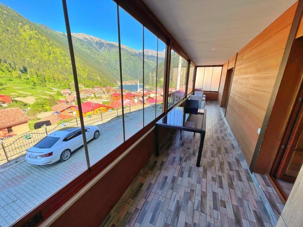 a room with a view of a car in a building at Helen Suit in Çaykara