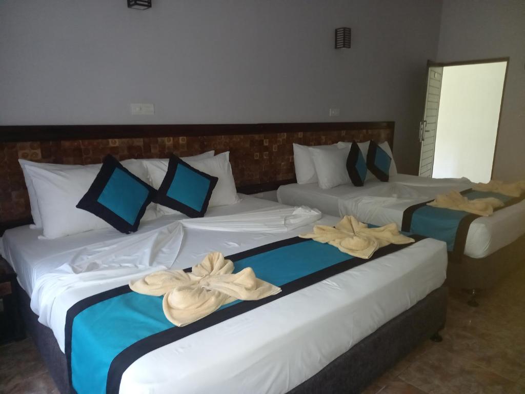 Postel nebo postele na pokoji v ubytování Blue Sand Beach Resort