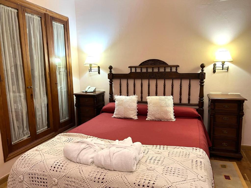 Postel nebo postele na pokoji v ubytování Hotel El Curro