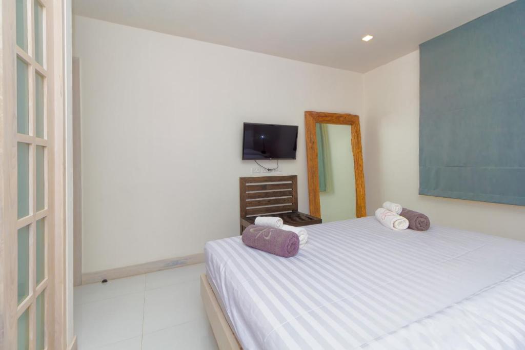 Postel nebo postele na pokoji v ubytování Hill Side Karon Kata Beach Condo