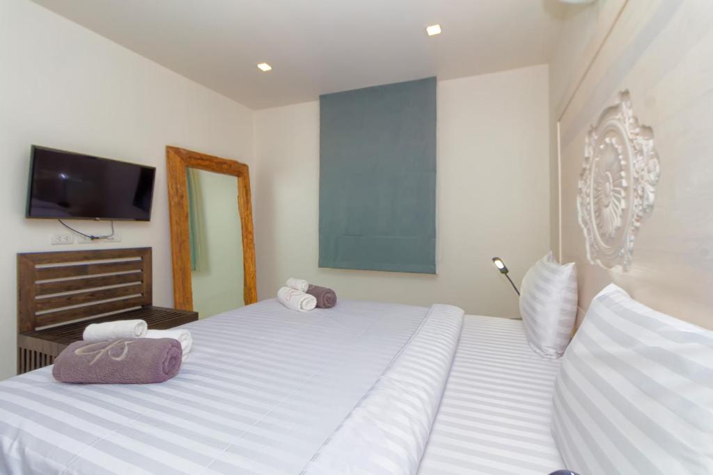 Postel nebo postele na pokoji v ubytování Hill Side Karon Kata Beach Condo