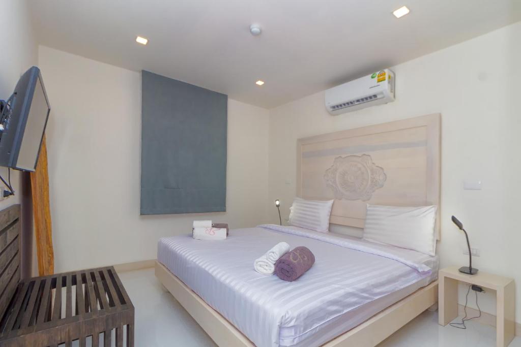 Postel nebo postele na pokoji v ubytování Hill Side Karon Kata Beach Condo