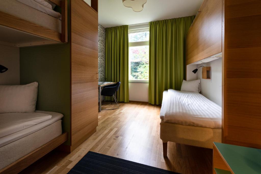 Postel nebo postele na pokoji v ubytování Bosön Hotell & Konferens