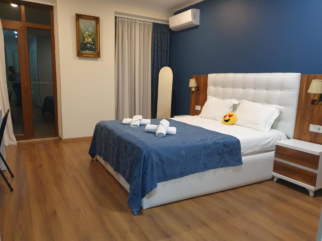 Postel nebo postele na pokoji v ubytování The Fresh Wave hotel