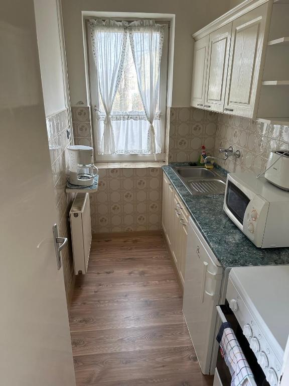 Kuchyňa alebo kuchynka v ubytovaní Home Sweet Apartment XL