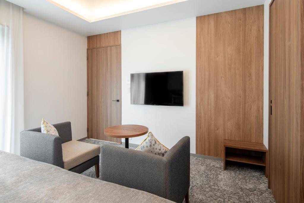 TV a/nebo společenská místnost v ubytování Tokyu Stay Shinjuku Eastside
