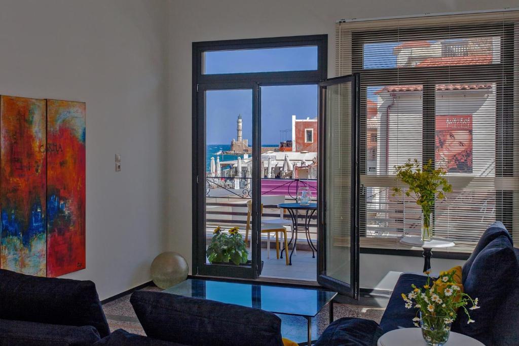 a living room with a view of a city at Faro Apartments in Chania