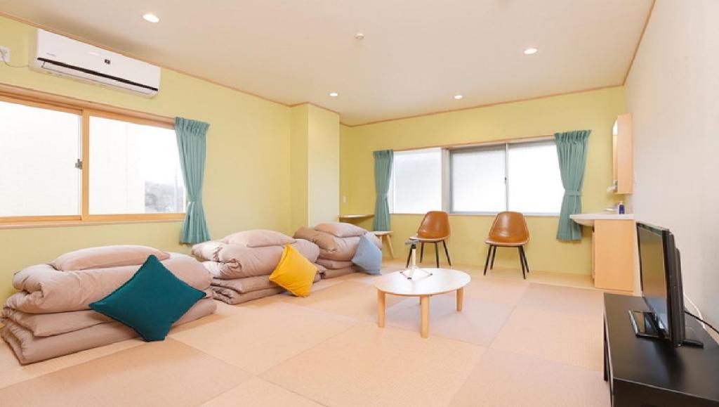 TV a/nebo společenská místnost v ubytování Onsen Petit Hotel Yukori Bandai Atami