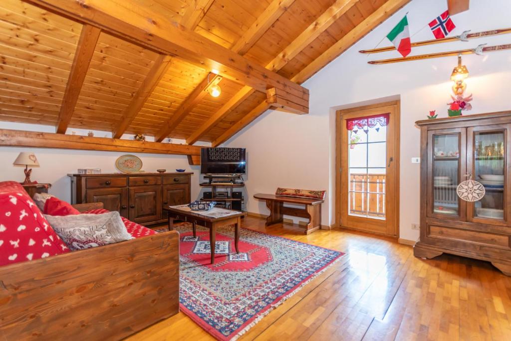 a living room with a couch and a table at Casa Fagher in Canale dʼAgordo
