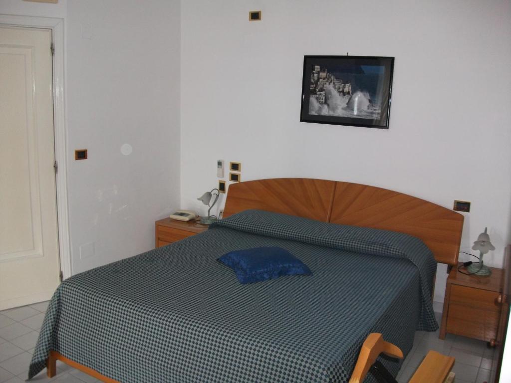 Postel nebo postele na pokoji v ubytování Holidays Baia D'Amalfi