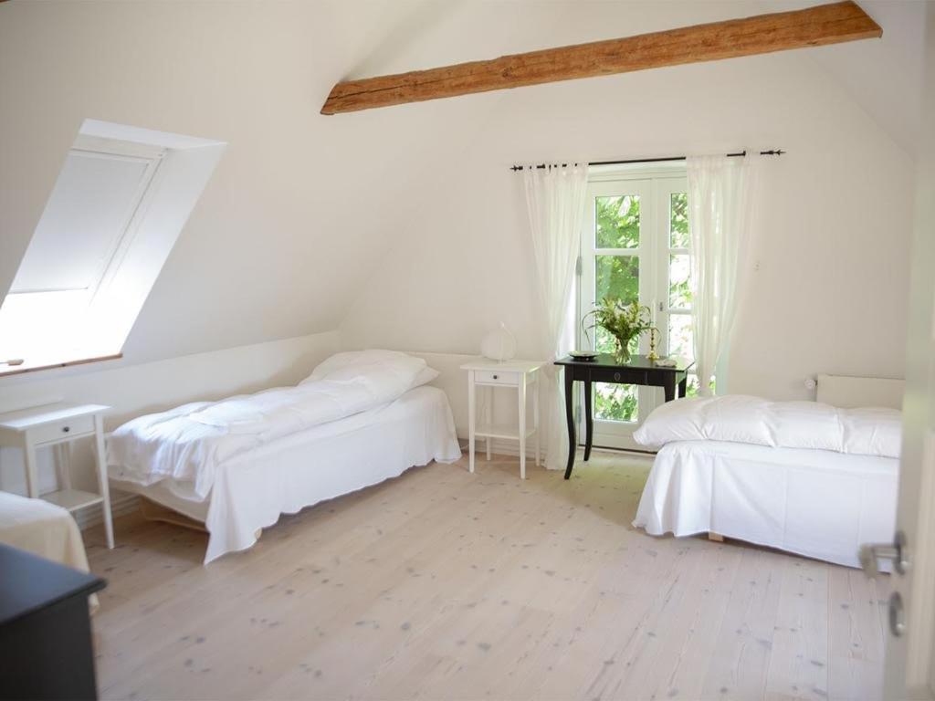 Postel nebo postele na pokoji v ubytování Mellem-rummet Guesthouse & Glamping