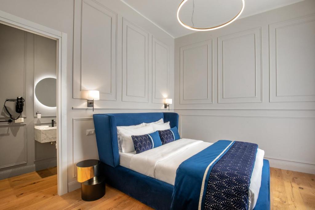 A bed or beds in a room at Garden Palace