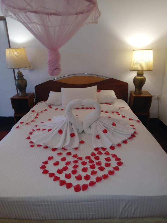 Postel nebo postele na pokoji v ubytování Hotel Shalini
