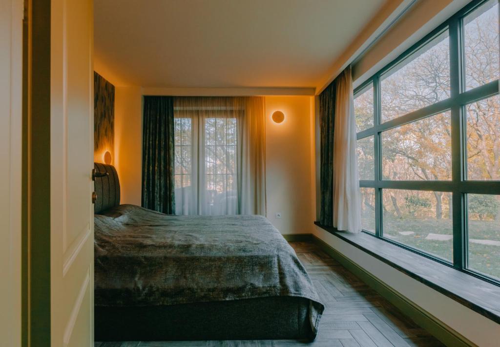 Postel nebo postele na pokoji v ubytování CROFT Villa