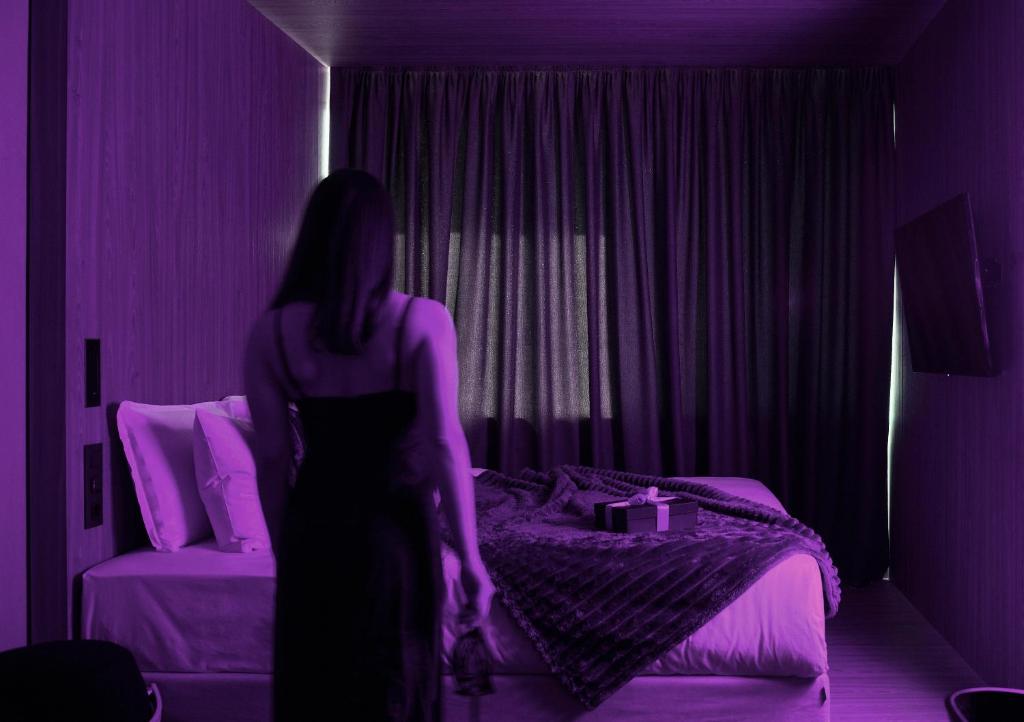 Posteľ alebo postele v izbe v ubytovaní ONOMA Hotel