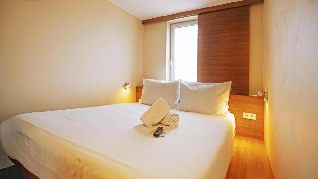 Postel nebo postele na pokoji v ubytování Hotel Düsseldorfer Hof