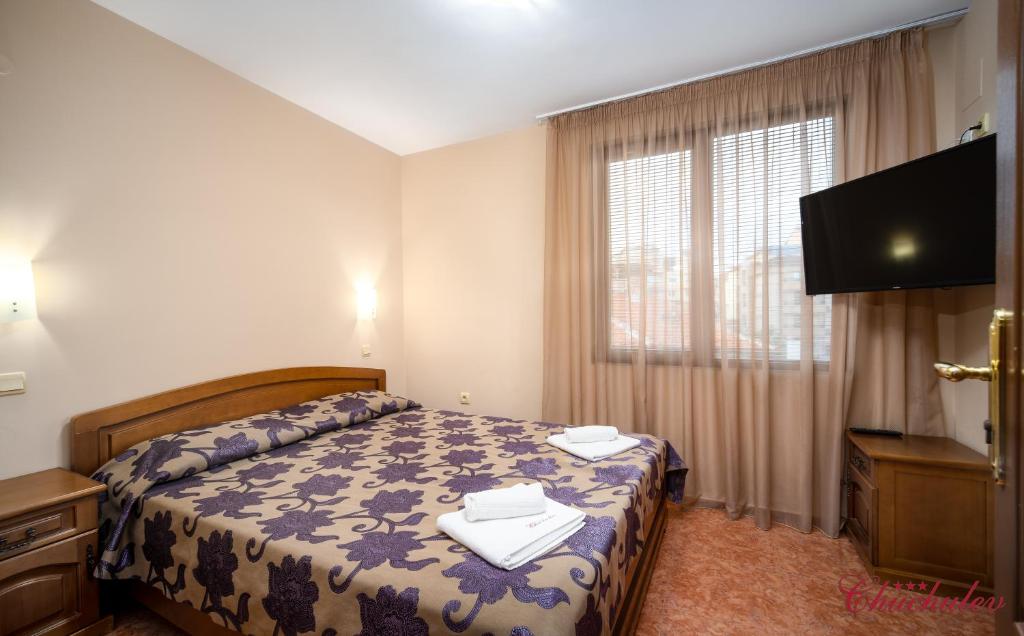 Postel nebo postele na pokoji v ubytování Hotel Chuchulev