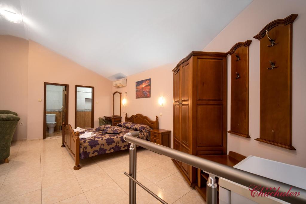 Postel nebo postele na pokoji v ubytování Hotel Chuchulev