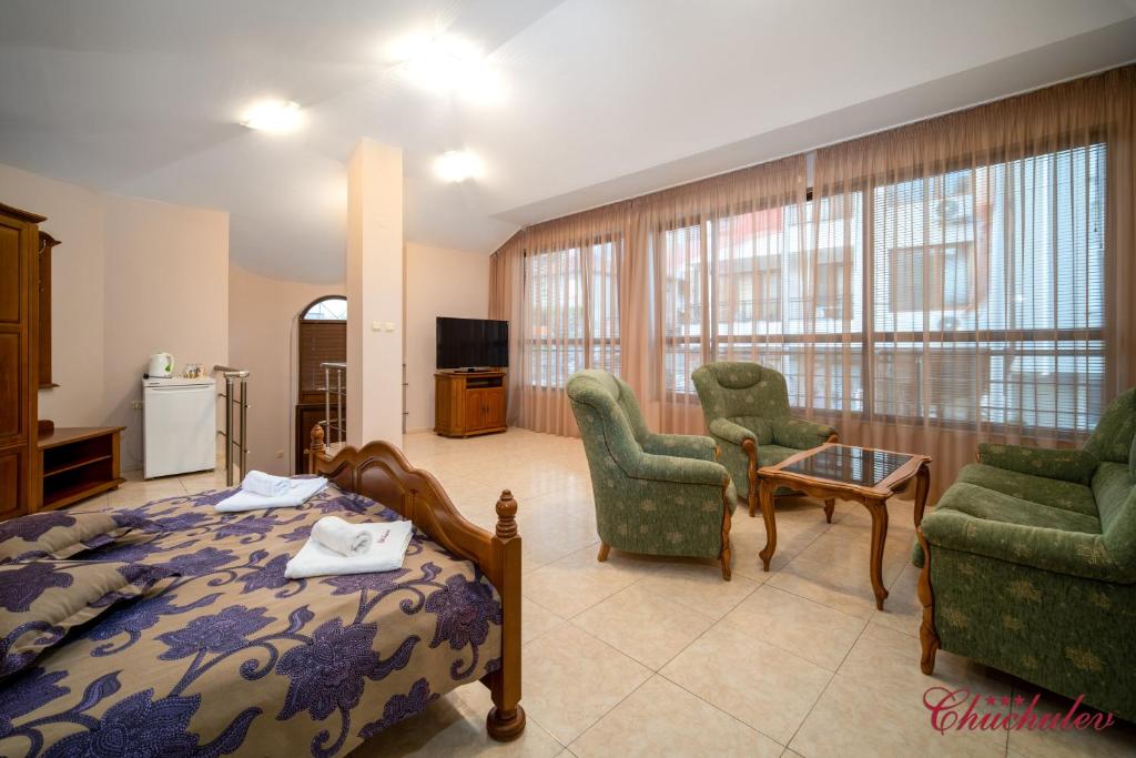Postel nebo postele na pokoji v ubytování Hotel Chuchulev