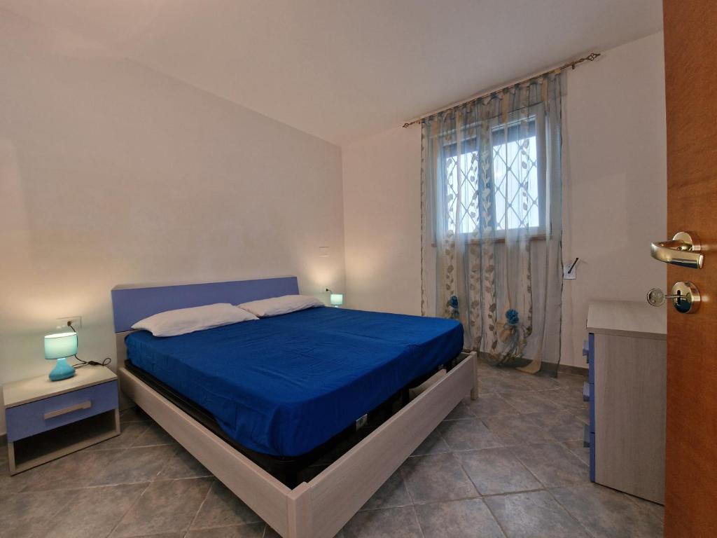A bed or beds in a room at Casa Vacanza Maria Fronte mare
