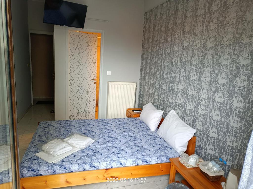 Postel nebo postele na pokoji v ubytování Georgios Rooms