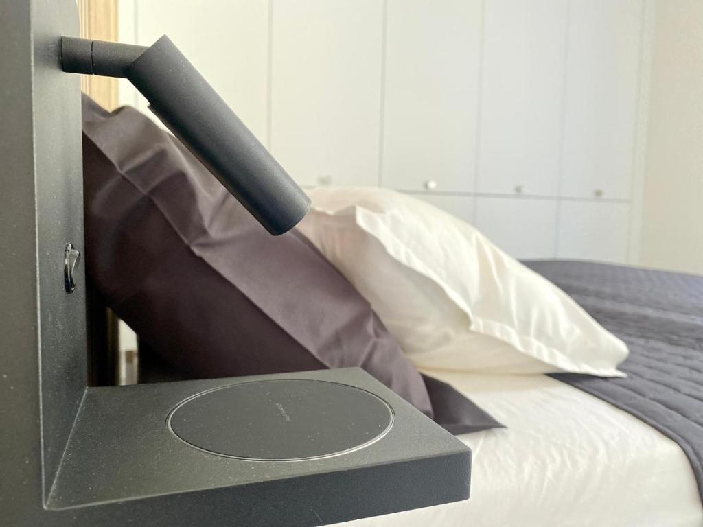 Postel nebo postele na pokoji v ubytování APARTMENT RIVA Lenno