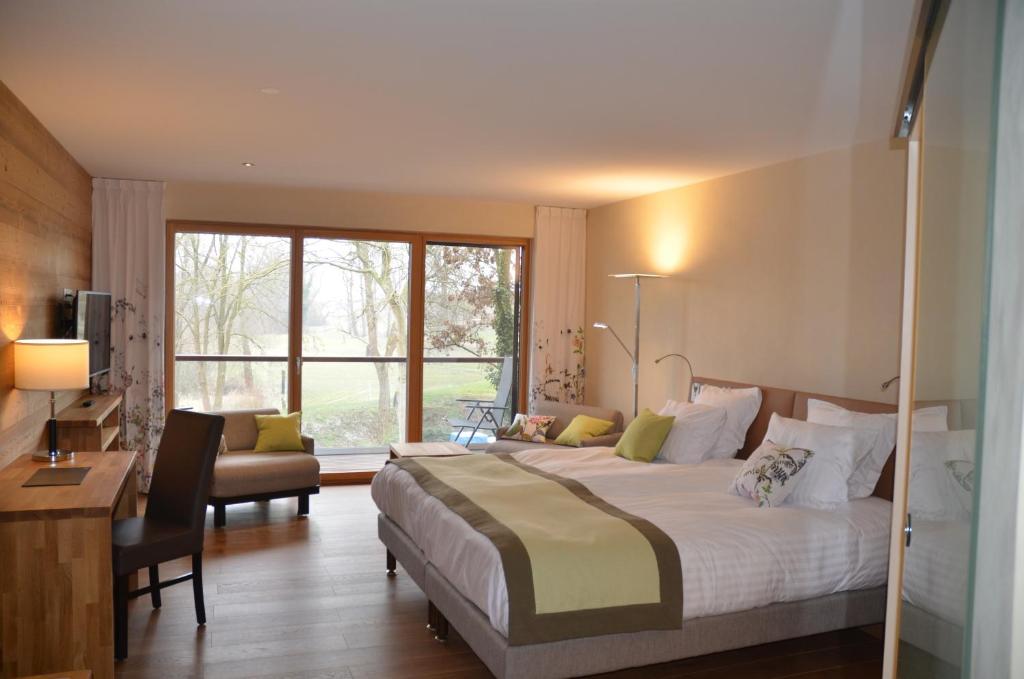 Postel nebo postele na pokoji v ubytování Hotel Le Caballin