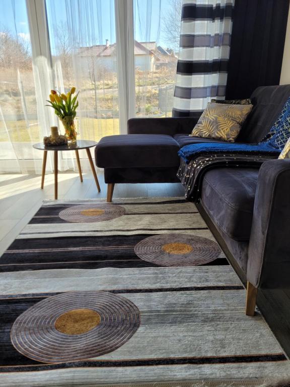 a living room with a couch and a table at Apartament Nina in Jelenia Góra