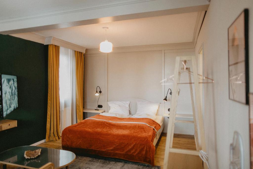 Postel nebo postele na pokoji v ubytování Peak Hotel & Event