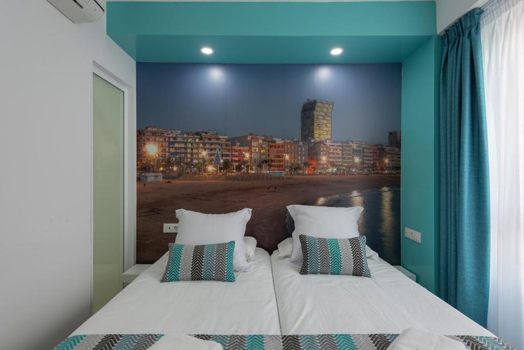 Posteľ alebo postele v izbe v ubytovaní Petit Accommodation Las Canteras Troisième