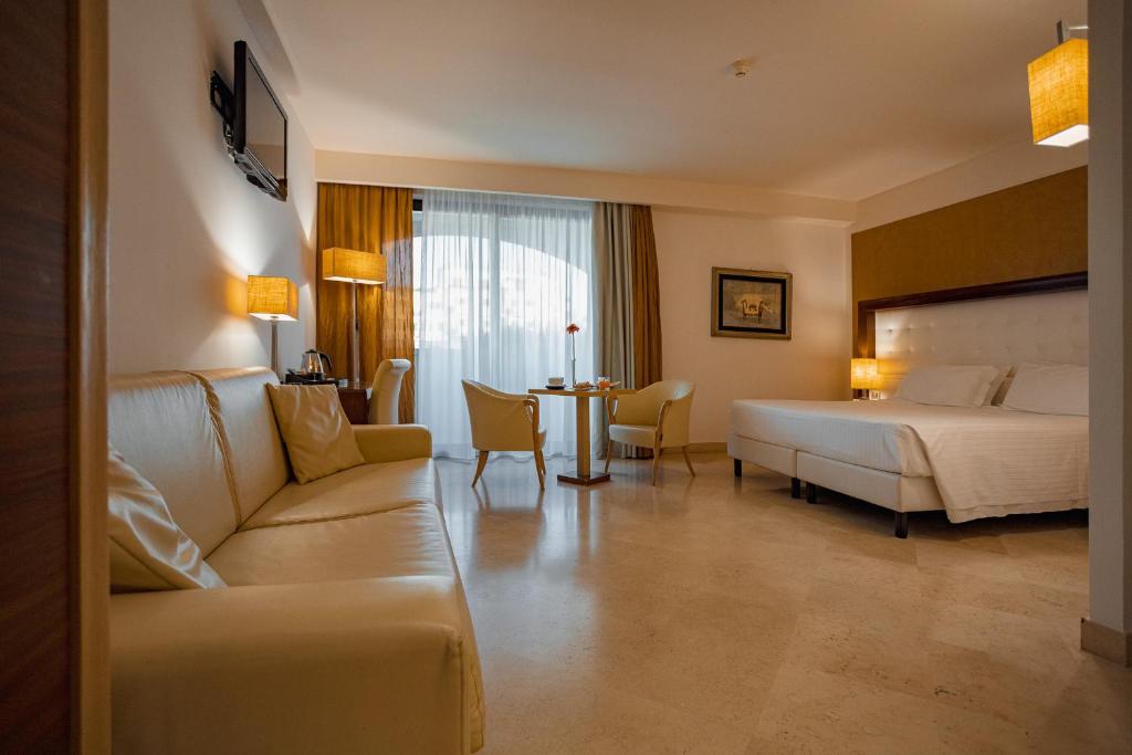 Postel nebo postele na pokoji v ubytování Vittoria Resort Pool & SPA