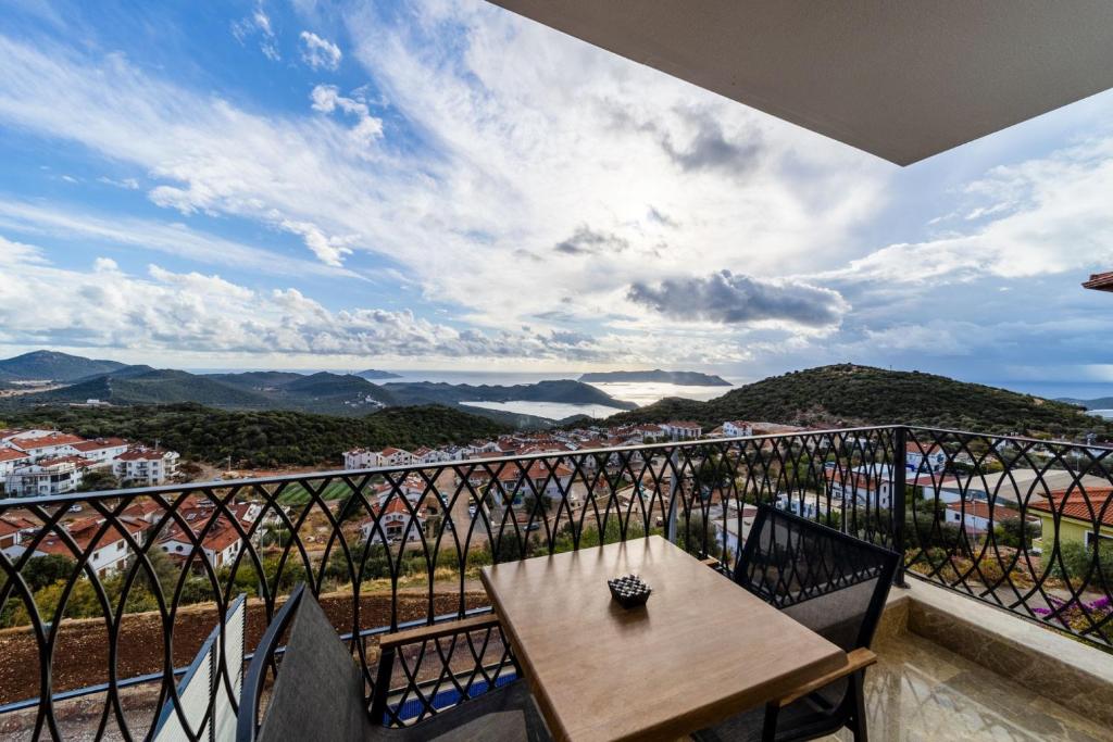 a balcony with a table and a view at Sea View Flat with Hot Tub in Antalya Kas in Kas