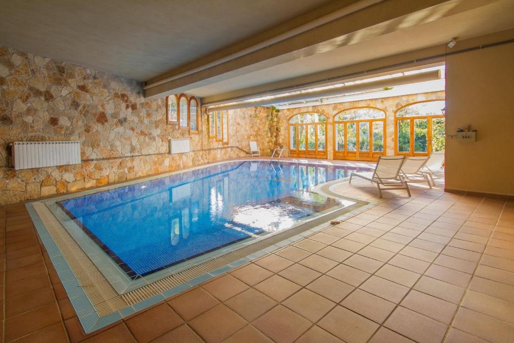 a large swimming pool in a house at Club Villamar - La Gamba in Sant Feliu de Guixols