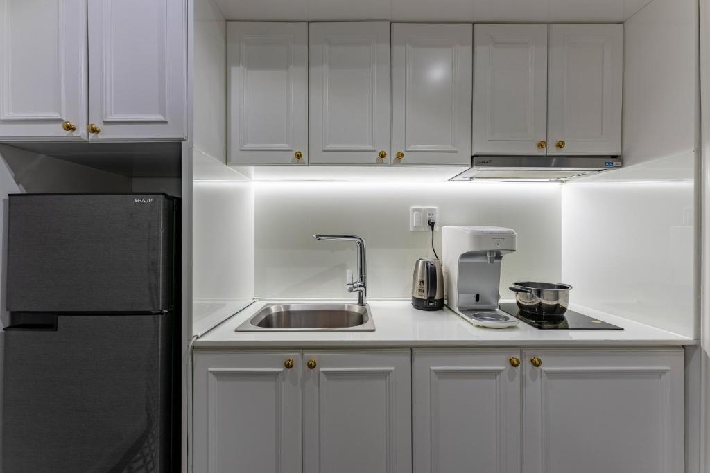 Kuchyň nebo kuchyňský kout v ubytování Ngan Ha 2 Apartment