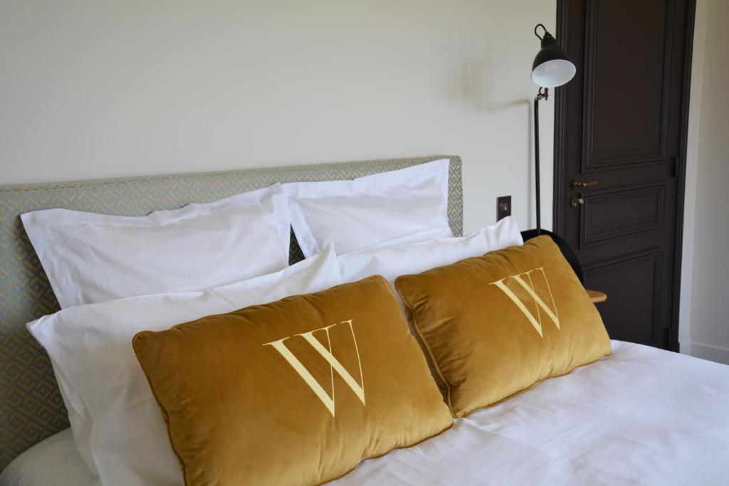 Postel nebo postele na pokoji v ubytování Hôtel Villa Walbaum