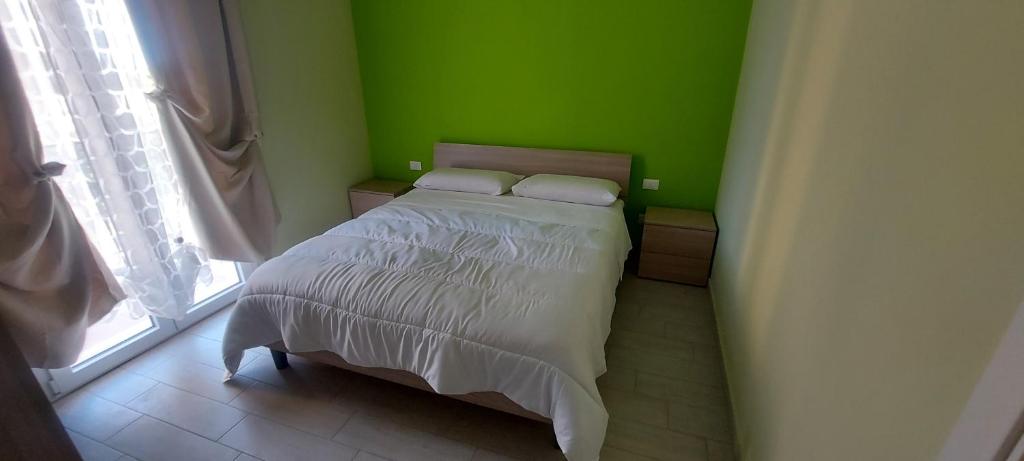 Posteľ alebo postele v izbe v ubytovaní Case vacanze LE ROSE